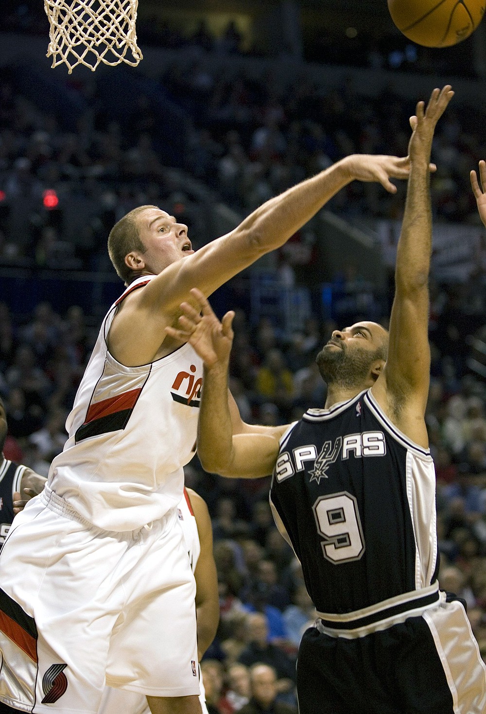 The Associated Press
Portland's Joel Przybilla, left, defends against Tony Parker on Friday in the Rose Garden.