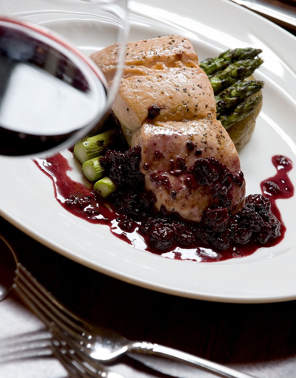 Steven Lane/The Columbian
Shelby's Coho salmon drizzled with blackberry sauce is served with fingerling potatoes, asparagus and a salad. One diner called it &quot;magic on a plate.&quot;