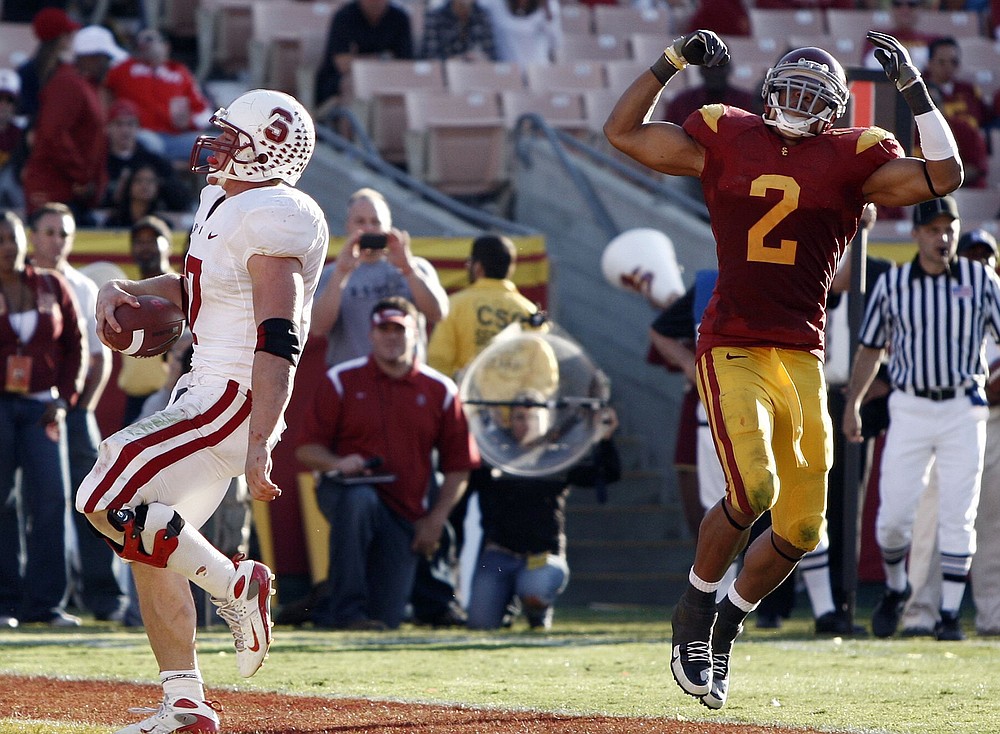 Matt Sayles/The Associated Press
Stanford running back Toby Gerhart, left, scores a touchdown as Southern California's Taylor Mays reacts during Stanfords' 55-21 victory on Saturday. Mays was miffed by the Cardinal's decision to go for a two-point conversion late in their lopseid win over the Trojans.