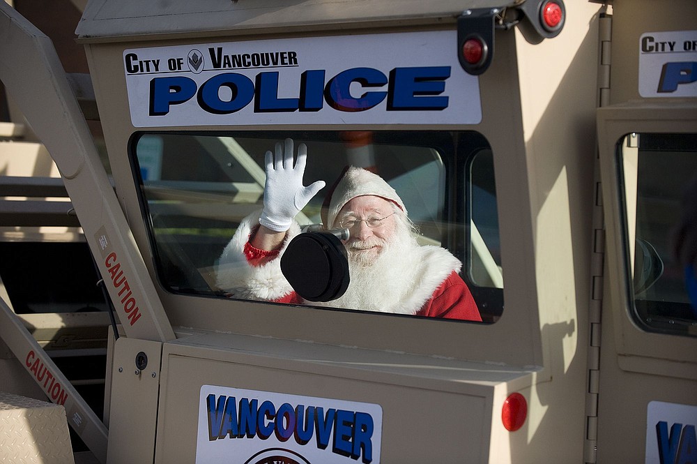 Steven Lane/The Columbian
Santa takes his turn testing out the Vancouver Police Department's Skywatch patrol tower Wednesday after a press conference at the Westfield Vancouver Mall to kick off the police department's &quot;Operation Christmas Presence.&quot;
