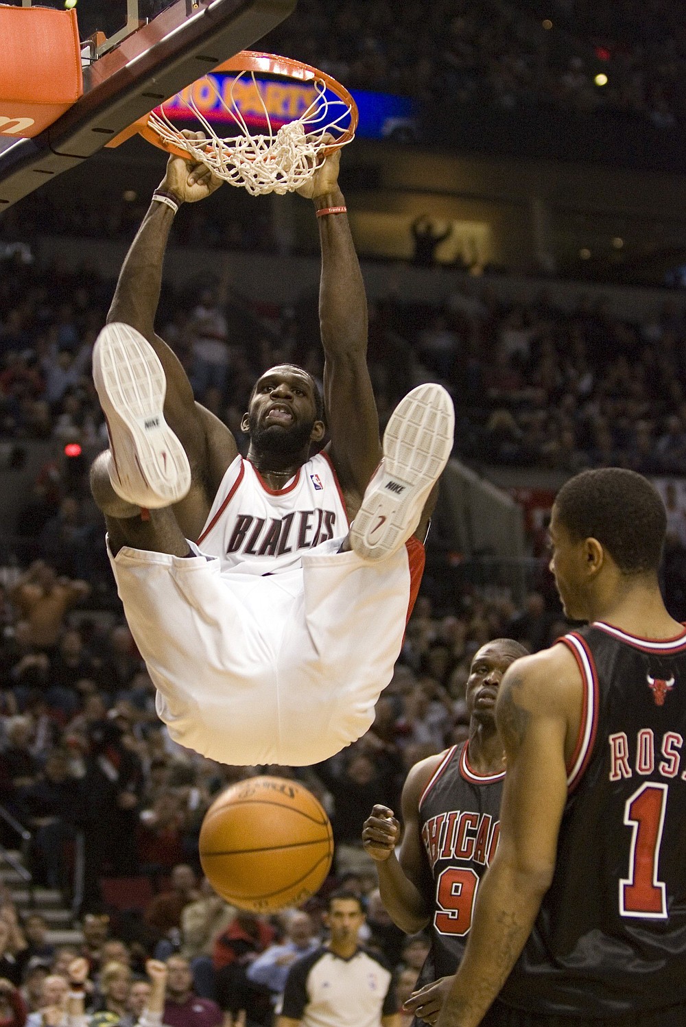 Don Ryan/The Associated Press
Portland's Greg Oden slams home two of his 24 points Monday in front of Chicago's Derrick Rose, right, and Luol Deng. Oden also had 12 rebounds and blocked two shots in the Blazers' victory.