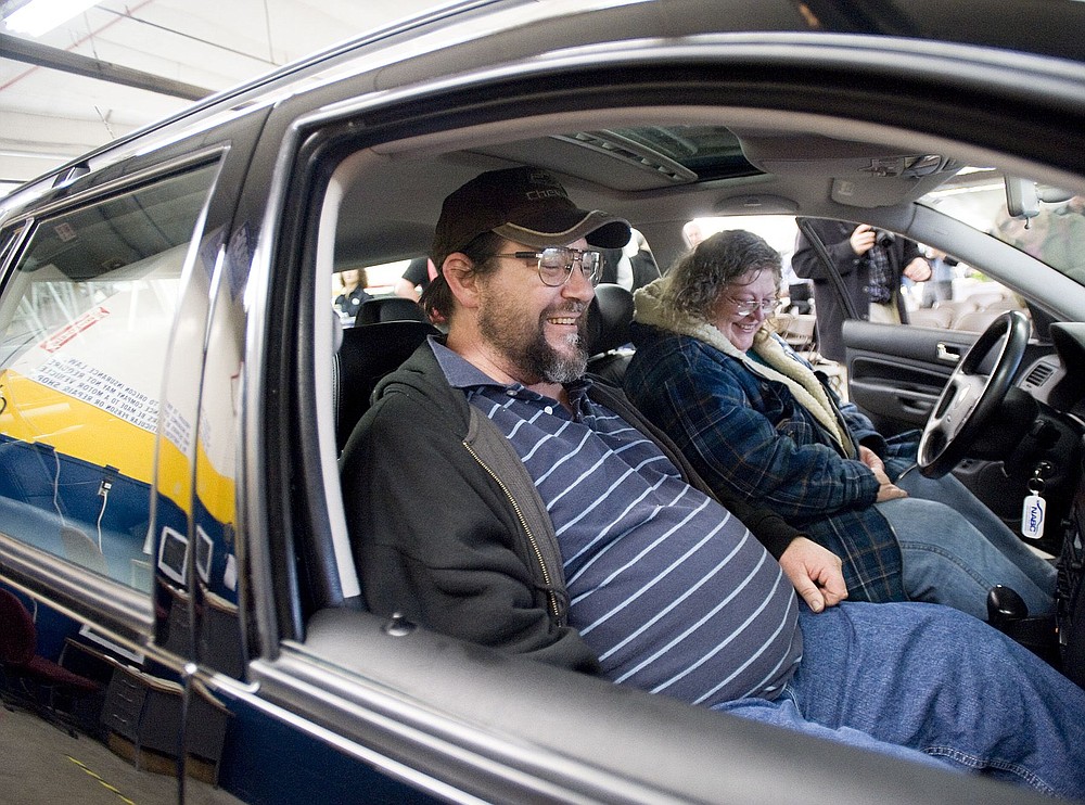 Dennis and Pamela Fryberger try out their refurbished 2005 Volkswagen Jetta station wagon, presented to them Monday.