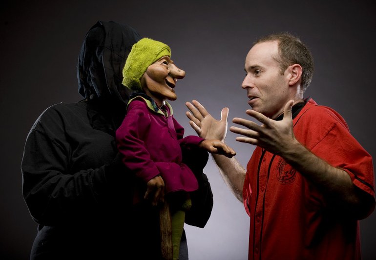 STEVEN LANE/The Columbian
Amy Gray, left, provides the voice and drives the movements of Tears of Joy puppet Rumpelstiltskin. ComedySportz-Portland players such as Andrew Berkowitz vie against puppets in the annual Puppetz vs. People production -- for the 10th show, this year, Berkowitz will referee.