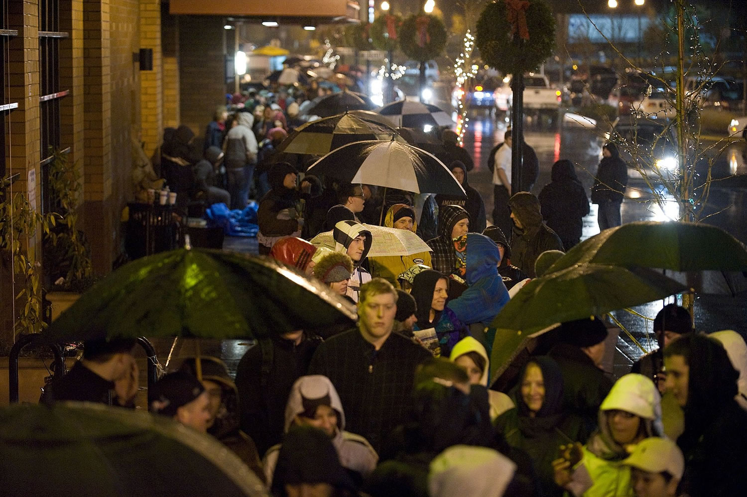 Steven Lane/The Columbian
Rain didn't deter bargain-hunters from waiting all night at Vancouver's Best Buy store. A stabilizing economy and shorter inventories may prevent extreme discounting as Christmas approaches.