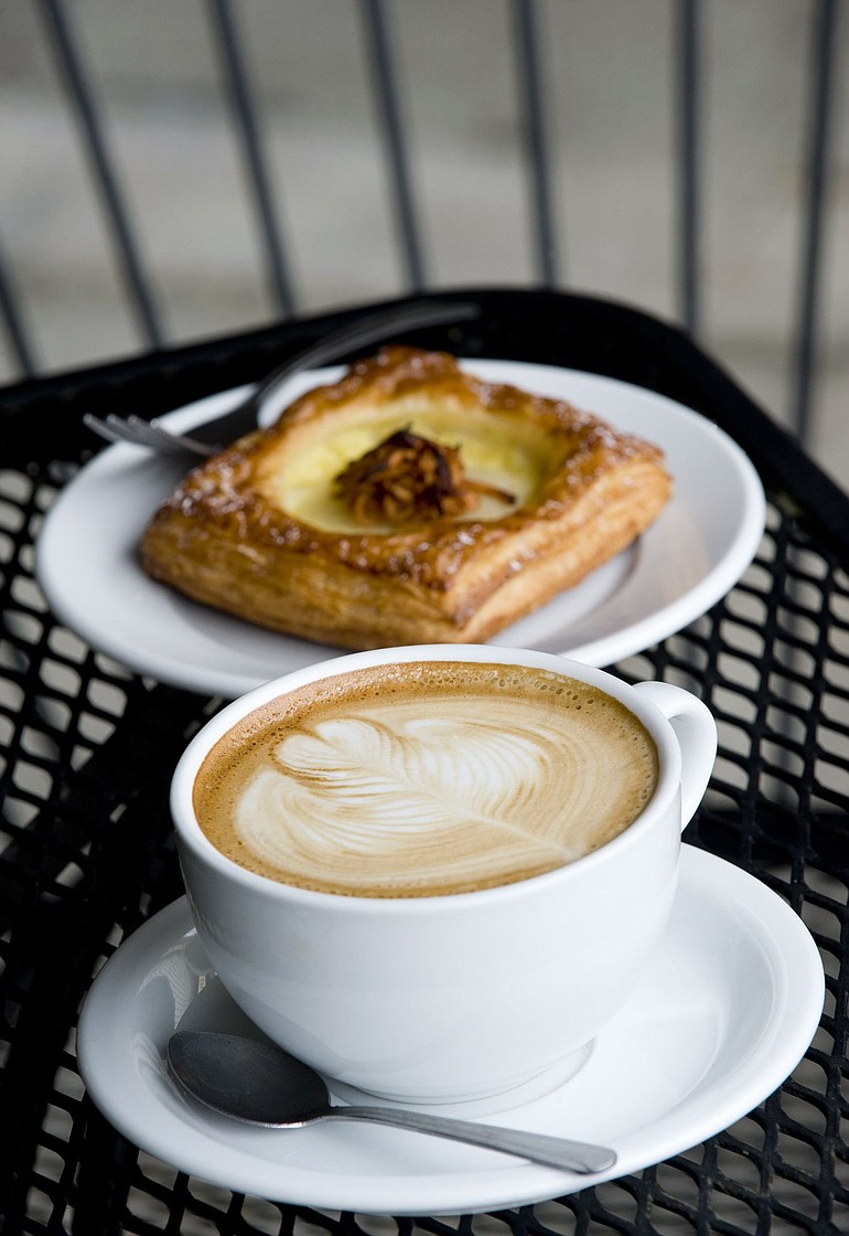 Steven Lane/The Columbian
Baristas at River Maiden take care to ensure the lattes are aesthetically pleasing. The coffee house also offers a selection of pastries and doughnuts including this Pear and Apple Danish from Nuvrei Pastries in Portland.