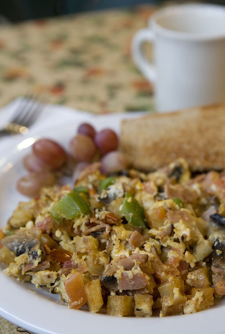 Vivian Johnson for The Columbian
The Corner Cupboard's Hash Brown Scramble is made with egg, ham, green pepper, mushroom, tomato, cheddar and Swiss cheeses and is served with honey wheat toast.