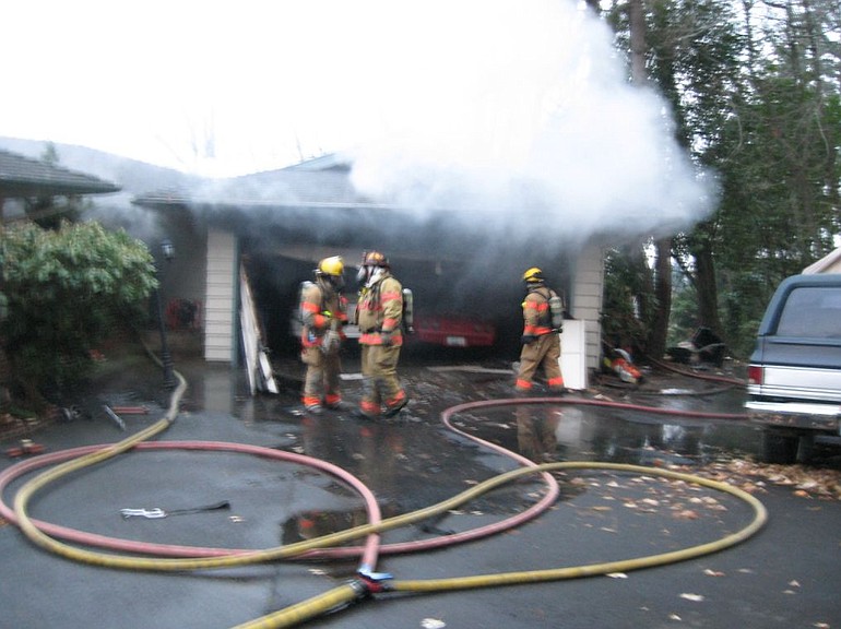 Kevin Murray/Vancouver Fire Department
Smoker's carelessness is thought to have caused this garage fire at 20201 S.E. Brady Road on Sunday afternoon. Damage to the garage and two vehicles was estimated at $100,000.