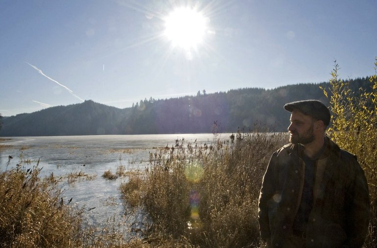 Zachary Kaufman/The Columbian
David Morgan stands on the shore of Mud Lake north of Ridgefield. The property could become part of a nature preserve taking shape in the northwest corner of Clark County.