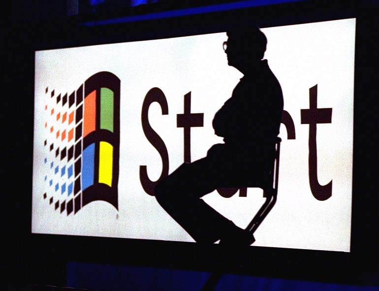 FILE - This Aug. 24, 1995 file photo shows Microsoft Chairman Bill Gates sitting on stage during a video portion of the Windows 95 Launch Event, on the company's campus in Redmond, Washington. The European Union said Wednesday Dec. 16, 2009 it is dropping antitrust charges against Microsoft Corp. after the company agreed to give Windows users a choice of up to 12 other Web browsers. Under the terms of the deal with regulators, Microsoft will avoid further EU fines if it provides a pop-up screen that lets European users _ from March _ replace Microsoft's Internet Explorer or add another browser such as Mozilla's Firefox or Google's Chrome.
