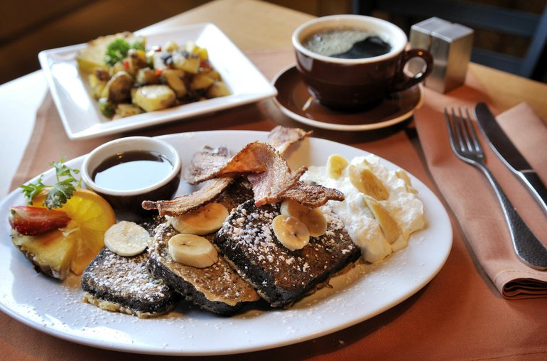 Troy Wayrynen/The Columbian
Farrar's Bistro's Banana Bread French Toast pairs well with bacon and Home Fries.