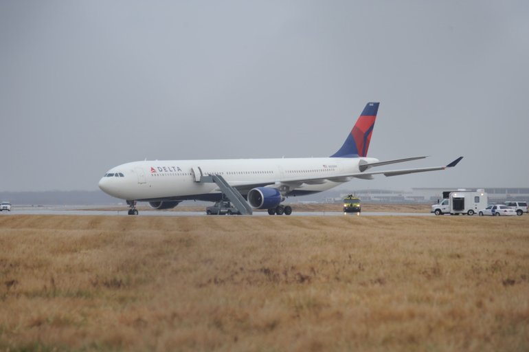 Associated Press photo
This picture provided by J.P. Karas shows Northwest Airlines Flight 253 on the runway after arriving at Detroit Metropolitan Airport from Amsterdam on Friday. Delta and Northwest have merged.