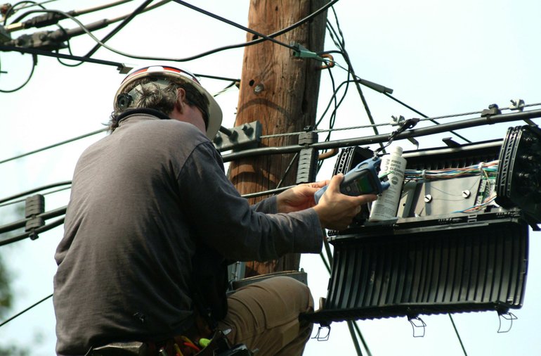 Verizon will continue to install fiber optic lines until the sale of its land lines to Frontier Communications is complete.