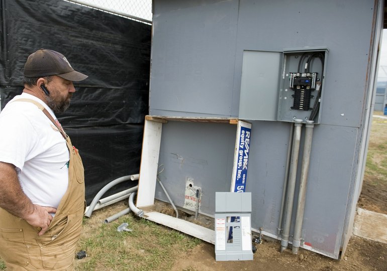 Chilly Taylor, groundskeeper at Harmony Sports Complex, surveyed the damage last summer after thieves ripped out most of the copper wiring to the field lights.