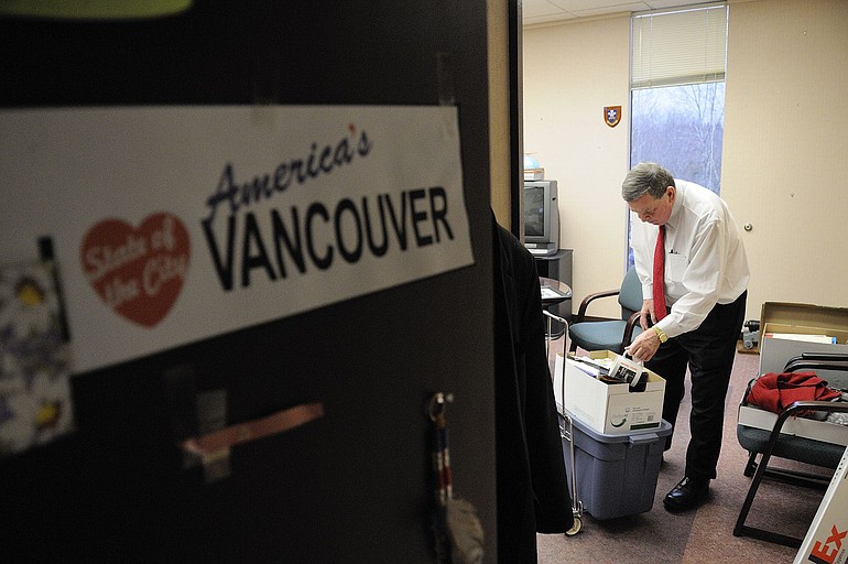 Vancouver Mayor Royce Pollard finishes placing 14 years' worth of belongings into boxes.