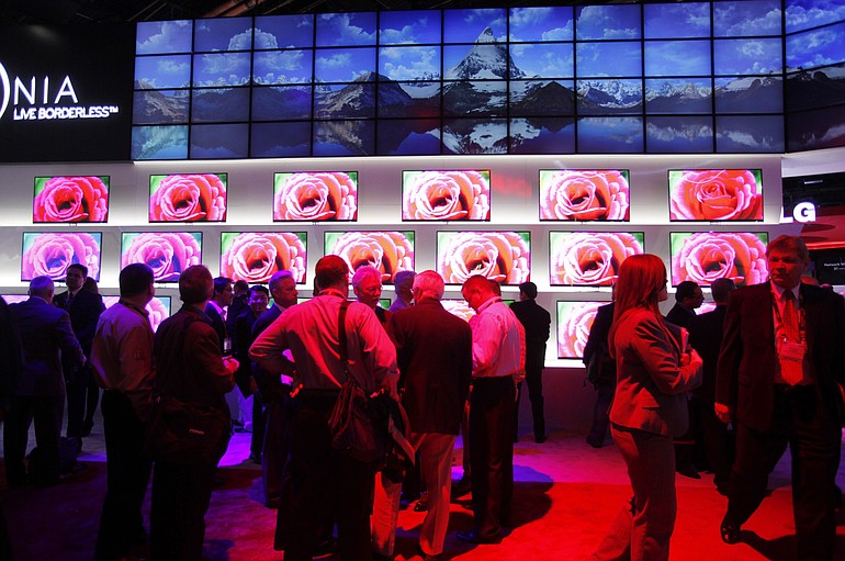 Attendees congregate Thursday near the LG exhibit at the Consumer Electronics Show in Las Vegas.