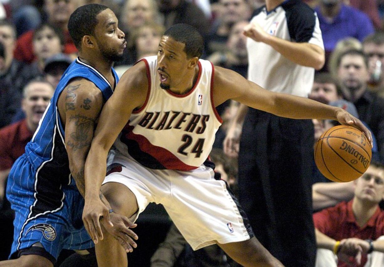 Orlando Magic's Jameer Nelson, left, guards against Portland Trail Blazers' Andre Miller Friday in Portland.