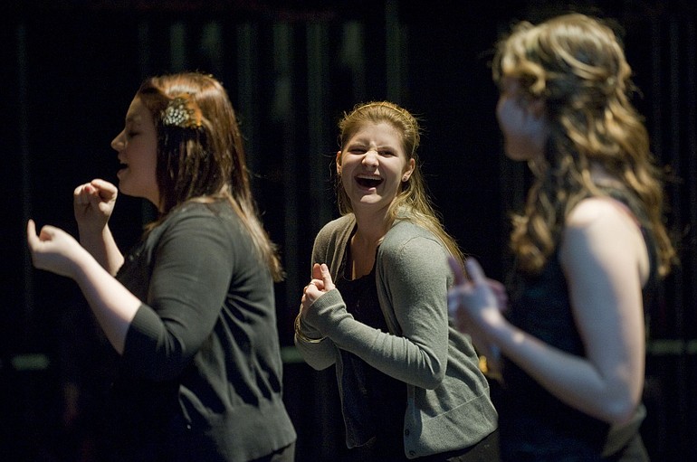 Makayla Plock, 16, left, Alysha Mueller, 16, and Caitlin Moore, 16, sign &quot;Stop! In the Name of Love&quot; by The Supremes while rehearsing for a show Thursday at Camas High School.