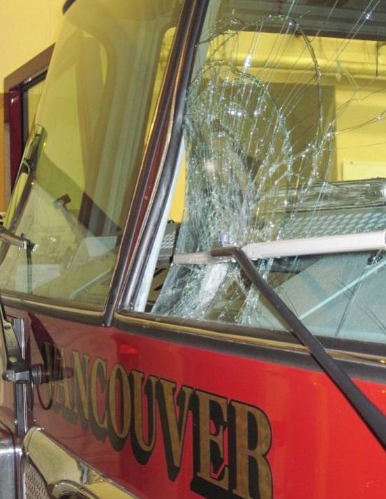 Shane Parker/Vancouver Fire Department
A large rock caved in part of the windshield of one of the Vancouver Fire Department's ladder trucks early Saturday.