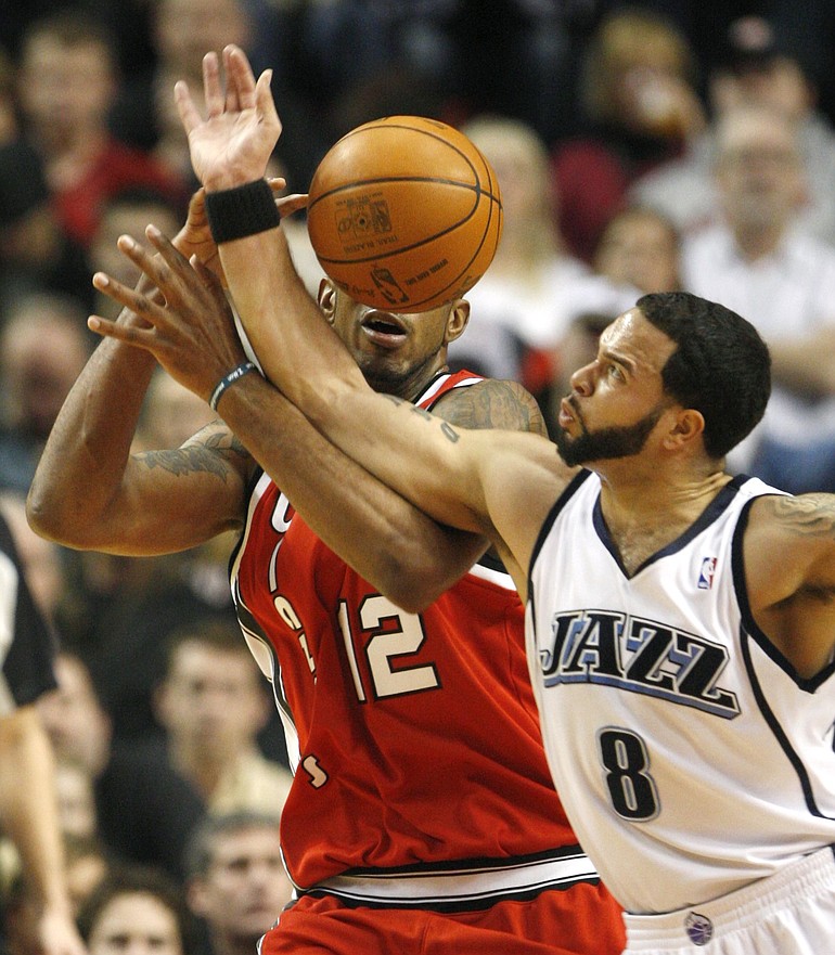 Rick Bowmer/The Associated Press
Utah Jazz's Deron Williams, right, reaches in to steal the ball from the Blazers' LaMarcus Aldridge (12) during the first quarter Wednesday.