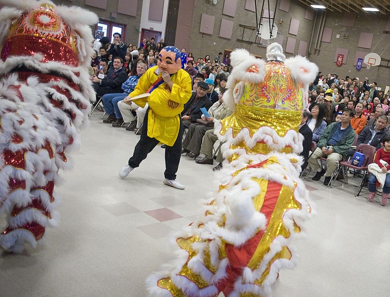 Lion dancers take the stage during the Tet festival held by Clark County's Vietnamese community Saturday at Eleanor Roosevelt Elementary School.