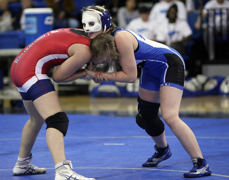 Hugh Scott/Courtesy of Oklahoma City University
Melissa Simmons, right, competes with a facemask after injuries suffered in a 2007 car wreck. She helped design her newest one.