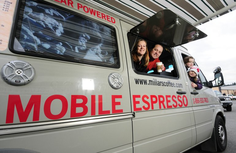Mary and Todd Millar, with children Devin, 9, and Nina, 5, run an environmentally friendly mobile espresso-making bar-on-wheels in Yacolt.