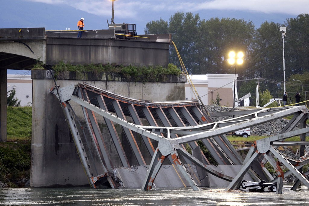 Associated Press files
The Washington State Patrol issued a final report last November saying that the truck driver who was driving an oversized load hit 11 arced sway braces on the bridge during the May 2013 accident that sent two cars into the river. The driver was ticketed in May for negligent driving.