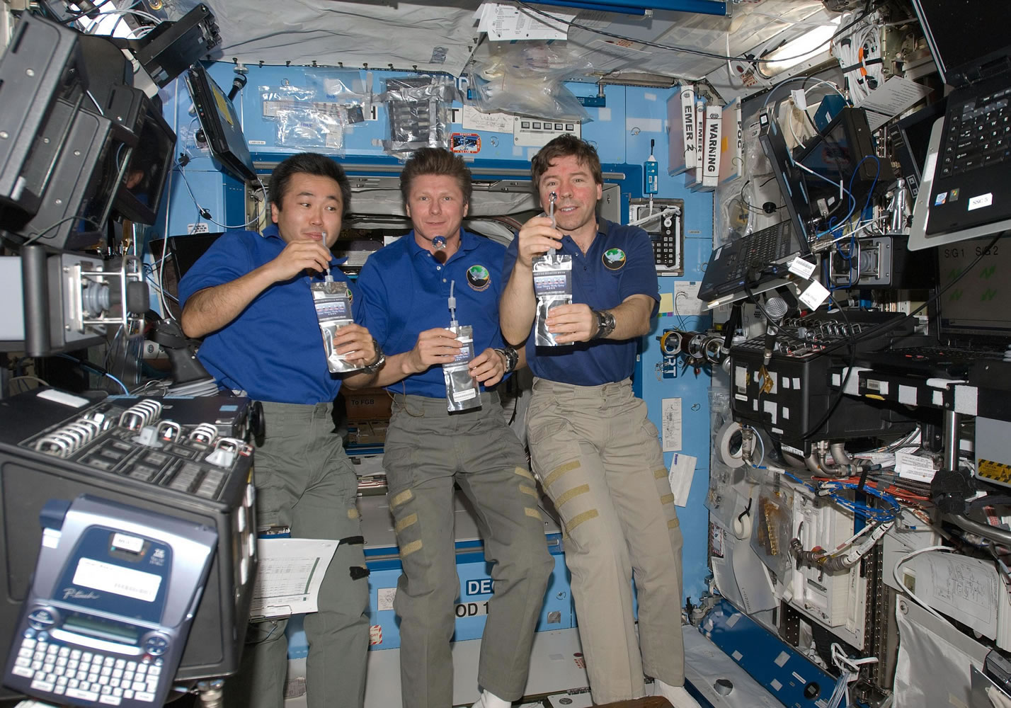 NASA/The Associated Press
Astronaut Mike Barratt of Camas, right, shares a toast with Koichi Wakata, left, and Gennady Padalka (a globe of water is floating in front of his chin) in a photo taken on May 20, 2009, to celebrate the space station's new water-recycling system.