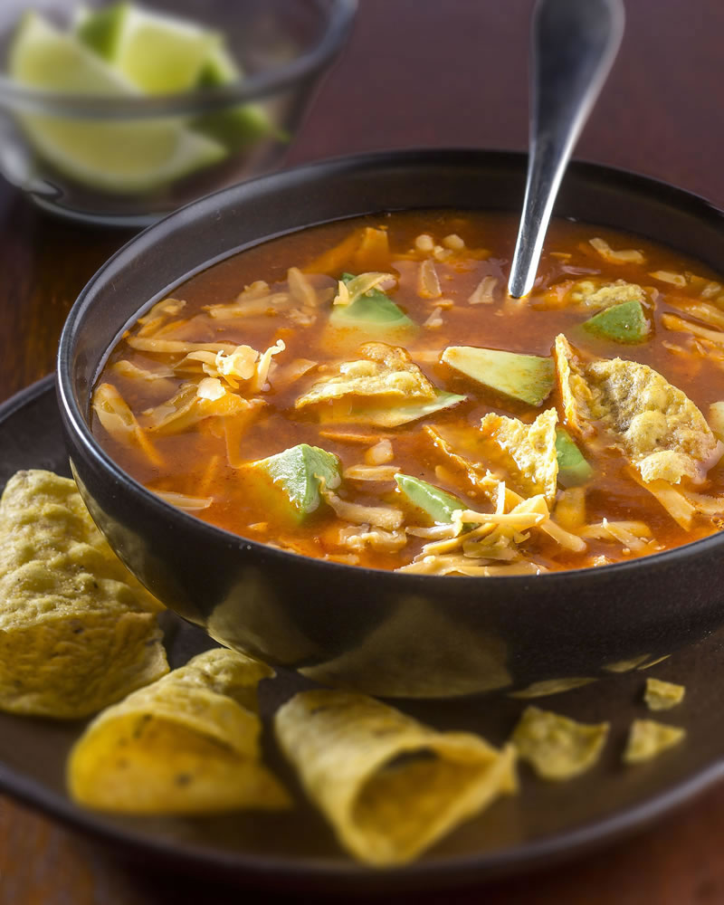 Put your chicken broth to delicious work in a tortilla soup, studded with strips of tender chicken and chunks of rich avocado.
