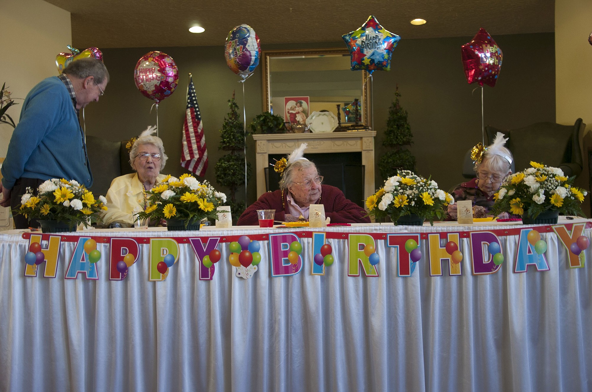Seated from left, Esther Friberg, Wilma Zillman and Dolly Anders are the guests of honor Sunday during a birthday celebration at the Cascade Inn retirement home in Vancouver.