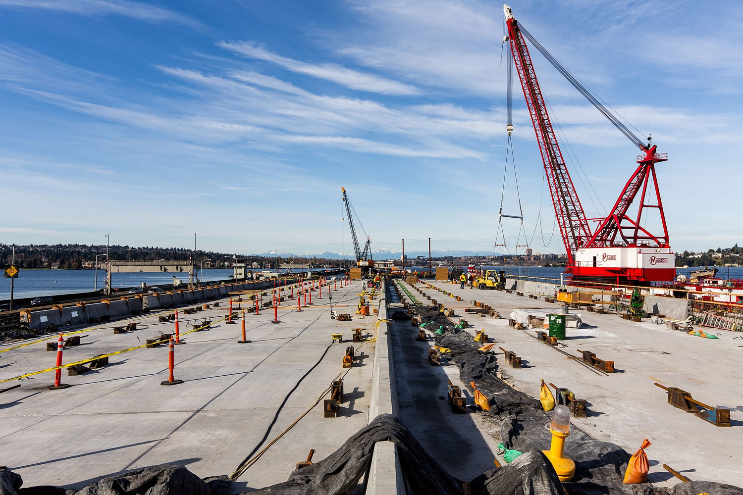 In this view looking west, construction continues Monday on the new state Highway 520 floating bridge near Medina.