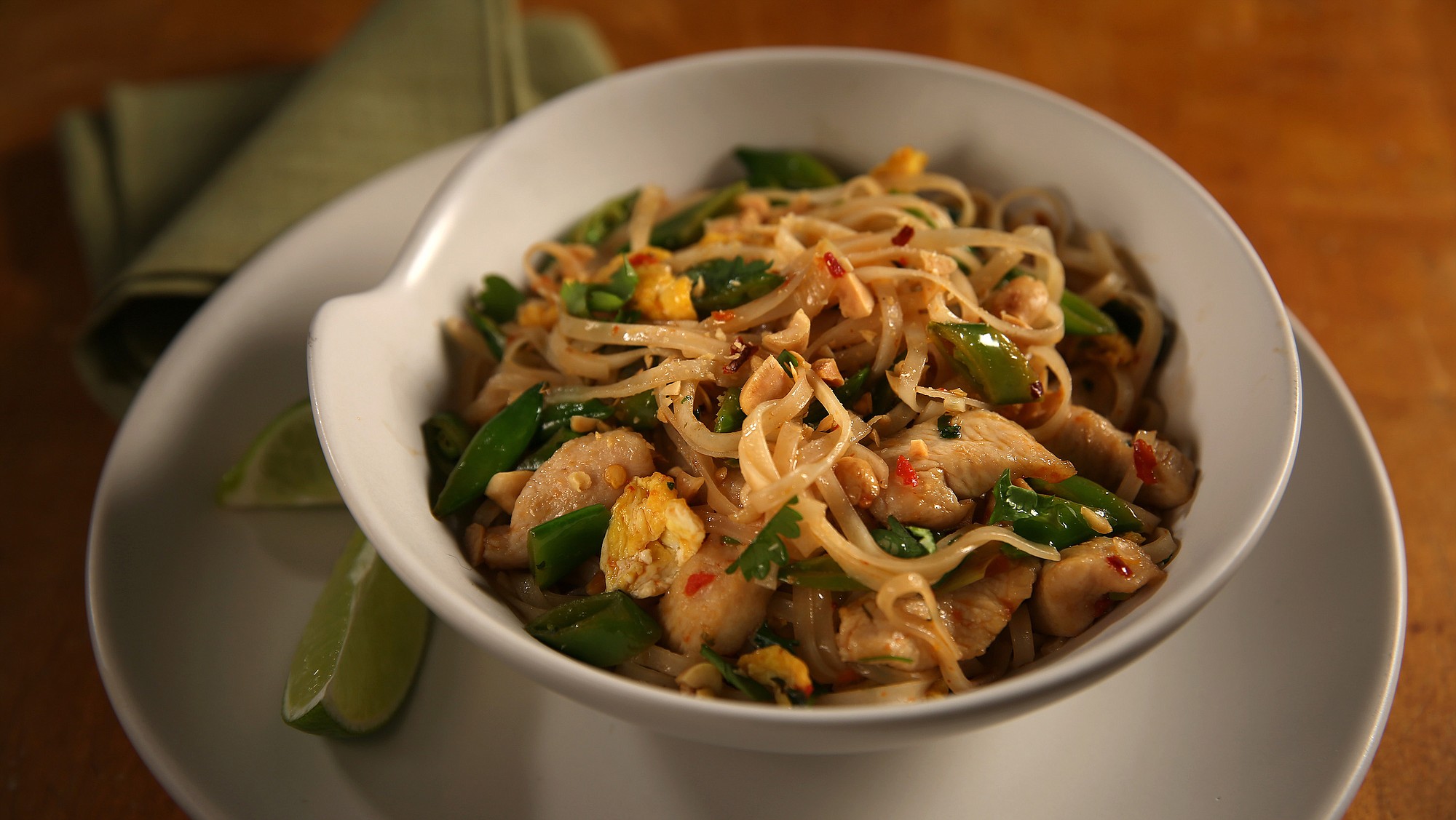 Homemade pad Thai is a tangle of noodles, peppers, spices and peanuts.