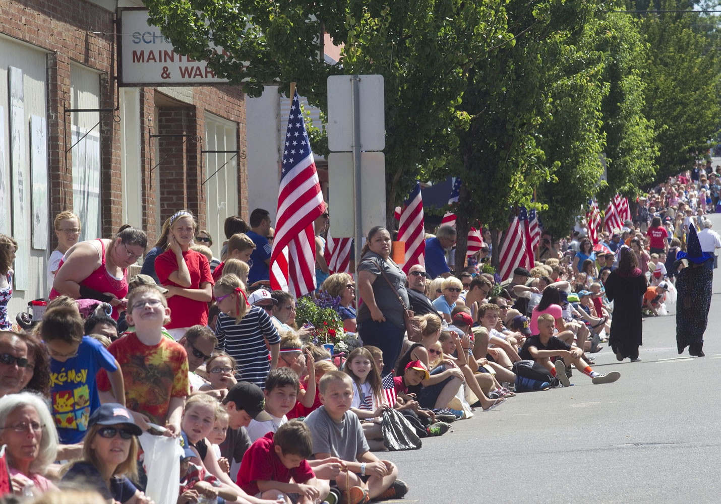 Scores of visitors line the streets to watch the Independence Day parade in Ridgefield on July 4.