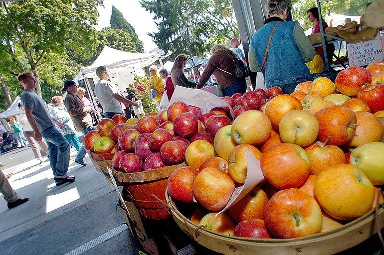 Apples and a variety of fresh fruits and vegetables await customers at the Vancouver Farmers Market.