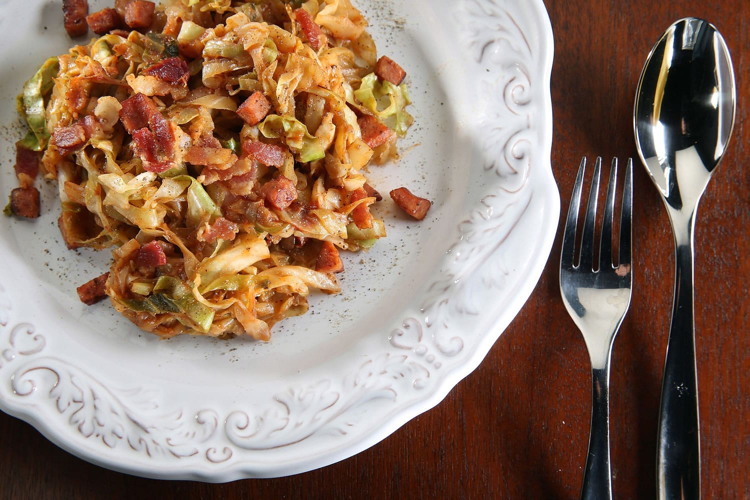 Cabbage shines with help from savory friends: andouille sausage, bacon and onions.