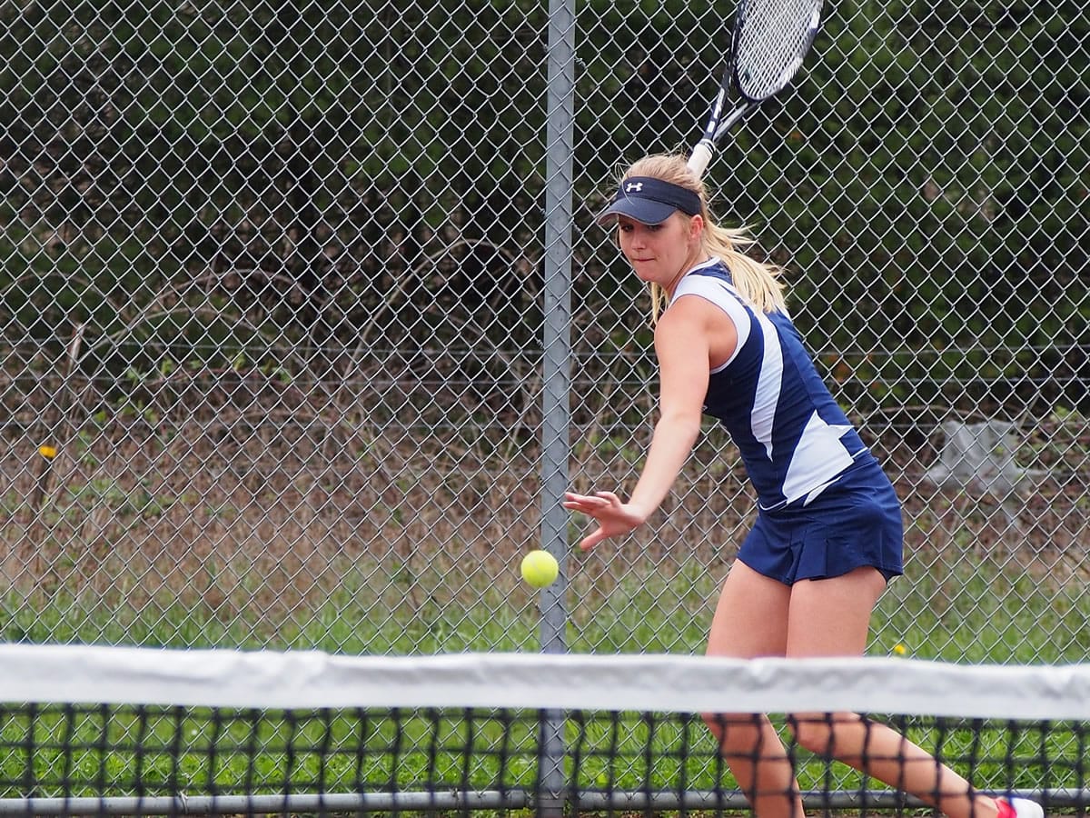 Sammi Hampton returns a shot while competing for Skyview High School in the spring.
