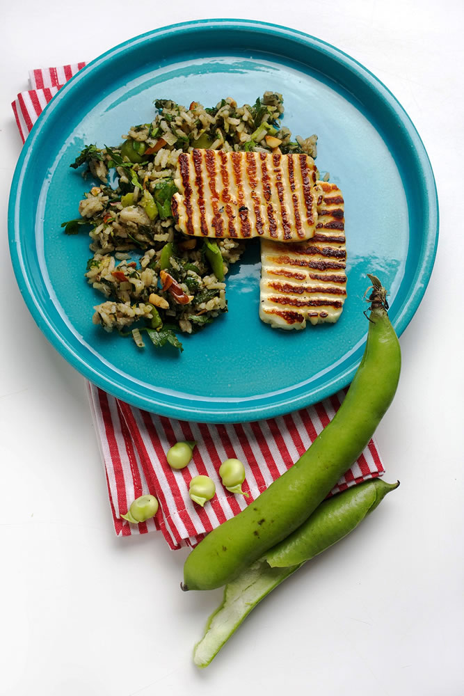 Deb Lindsey for The Washington Post
Fava Bean and Spinach Pilaf is served with grilled slices of halloumi, a cheese from Cyprus -- you could also fry the halloumi.