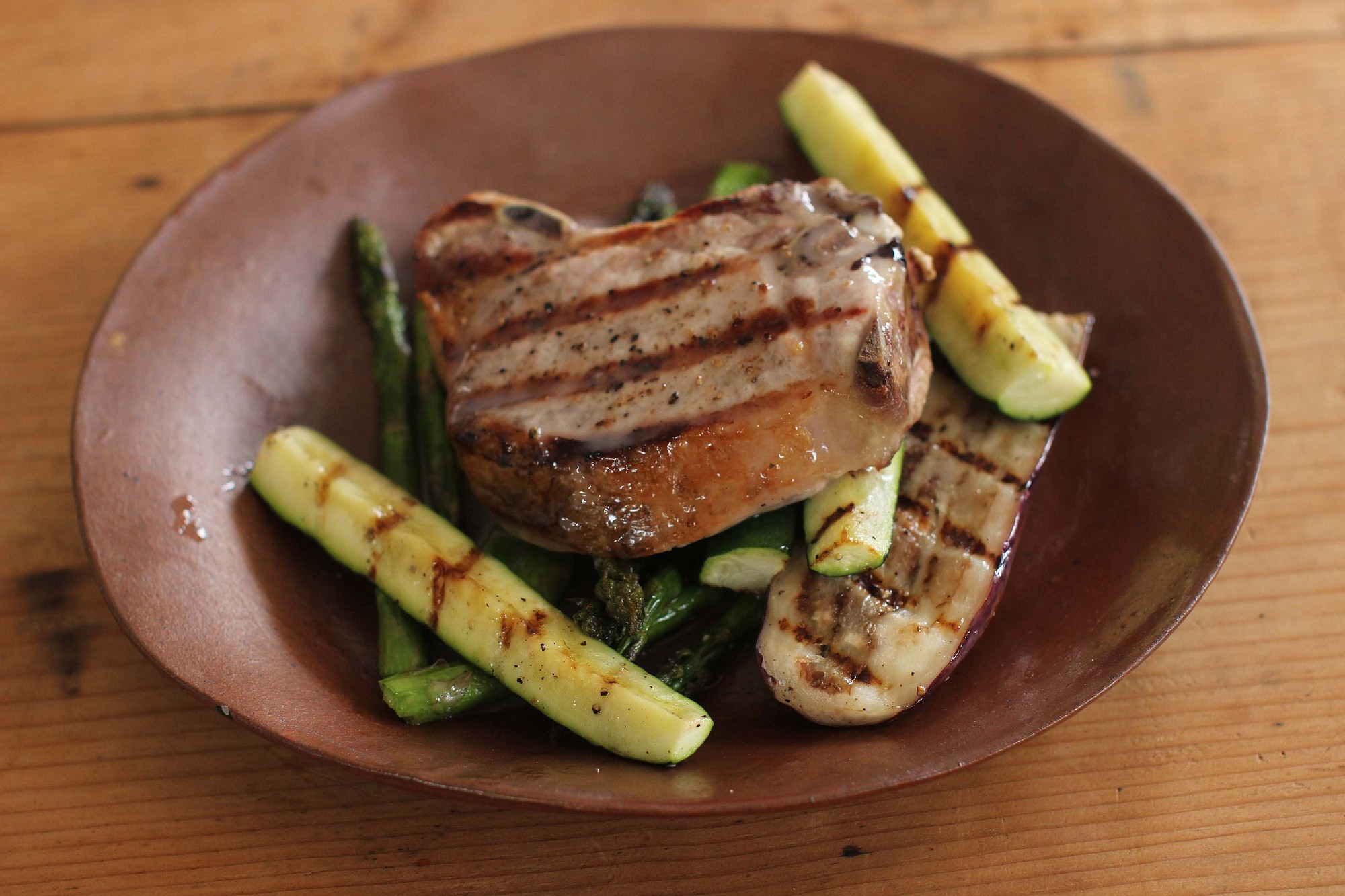 Grilled pork chops and asparagus with lemon truffle viaigrette.