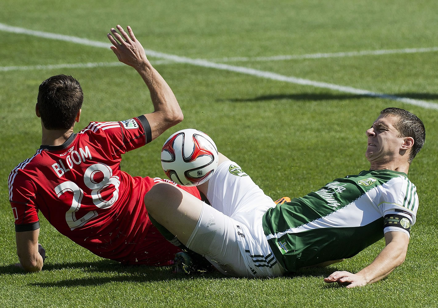 Portland Timbers midfielder Will Johnson, right, has not played since suffering a broken leg on this play in a match last September in Toronto.