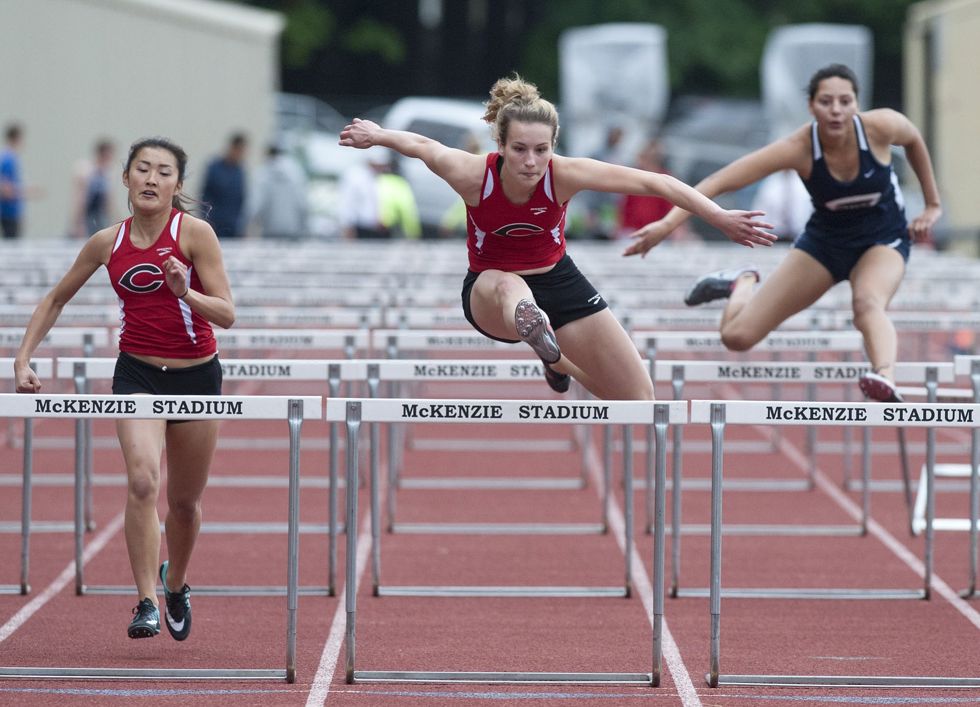 Camas High School's Jordan Davis clears a hurdle in the women's 100m Hurdles as she competes at the 4A GSHL District track meet at McKenzie Stadium in Vancouver Tuesday May 19, 2015.
