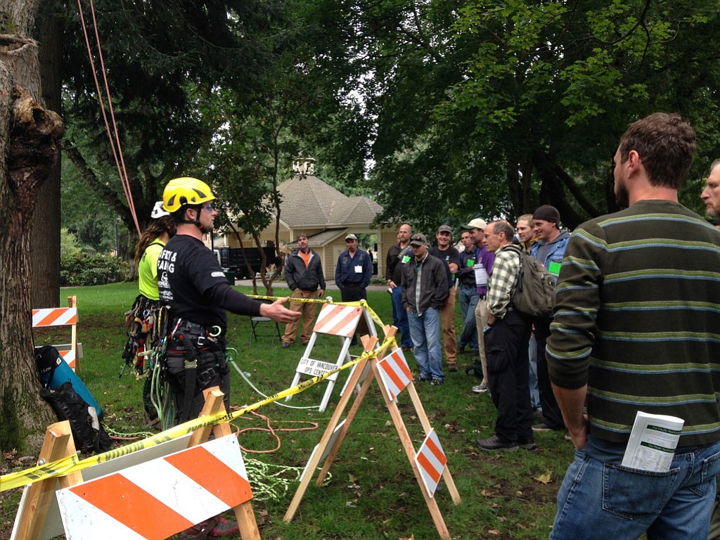 Arborists discuss tree-climbing methods in Esther Short Park as part of the Pacific Northwest International Society of Arboriculture conference at the Hilton Vancouver Washington.