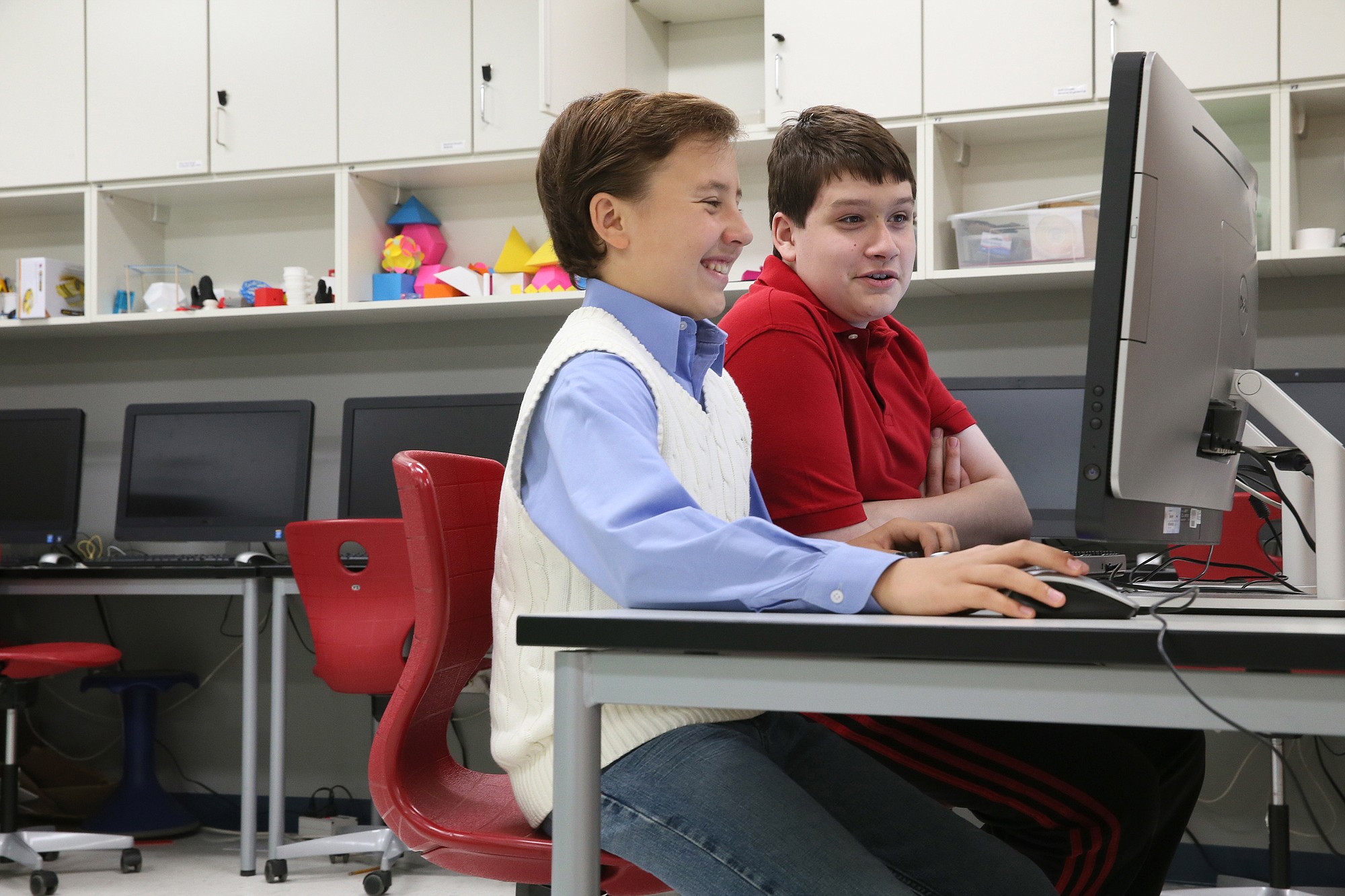 Seventh-graders Mitchell Brown, 12, left, and Scotty Vrablik, 13, work on their website www.cleanminecraftvideos.com in the Innovation Lab at Quest Academy in Palatine, Ill., on Wednesday.