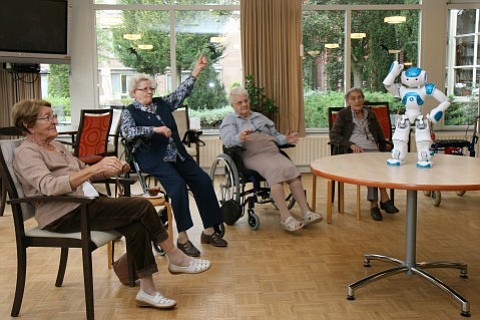 Regy van den Brand/The Washington Post
Residents of the Dutch retirement home Vughterstede follow Zora the robot's instructions during a physical therapy class. The Zora robot is also being used in hospitals and one psychiatric institution.