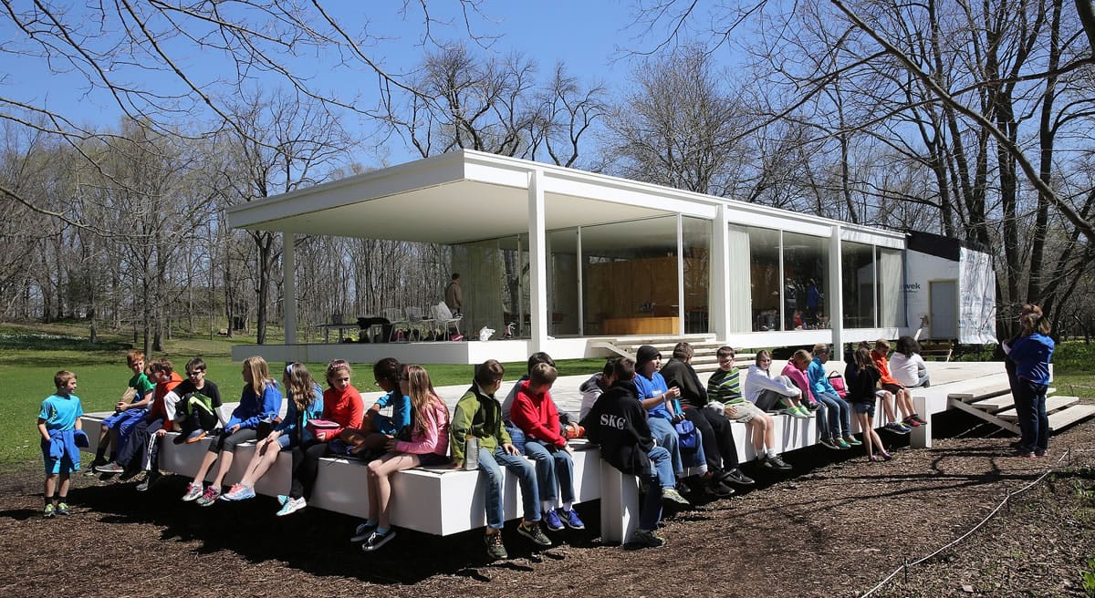 Students from Western Avenue Elementary School in Geneva, Ill., wait for their turn to tour the Farnsworth House on April 25, 2014, in Plano, Ill.