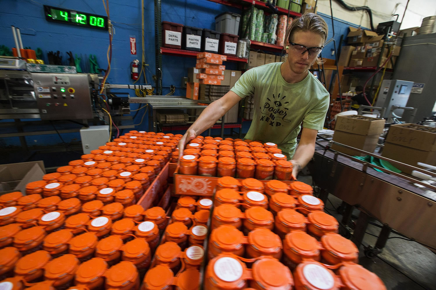 Craig Becker stacks freshly canned Summer Ale at Fremont Brewing in Seattle.