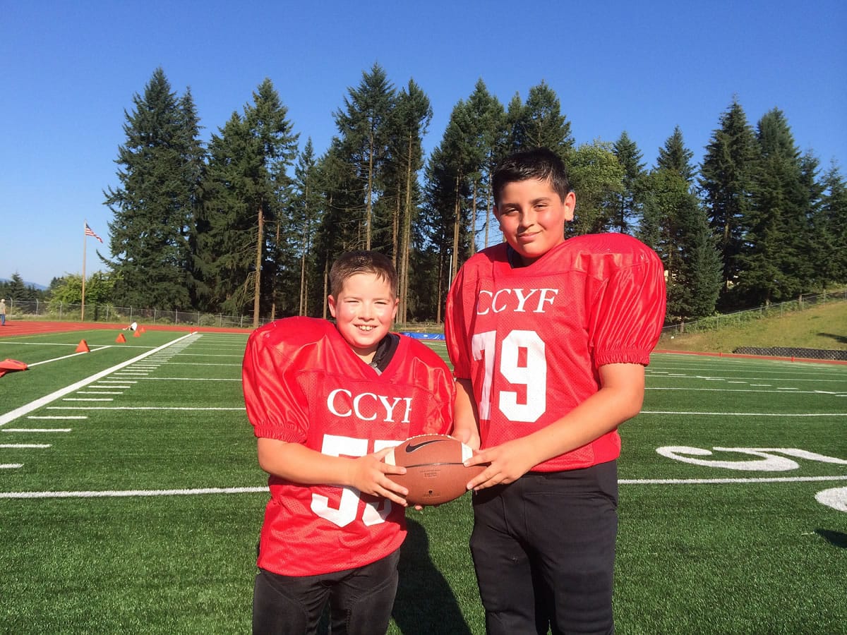 Before becoming players for Clark County Youth Football, Caden Brown, left, and Zach Paterson were patients at Shriner's Hospital and Doernbecher Children's Hospital.