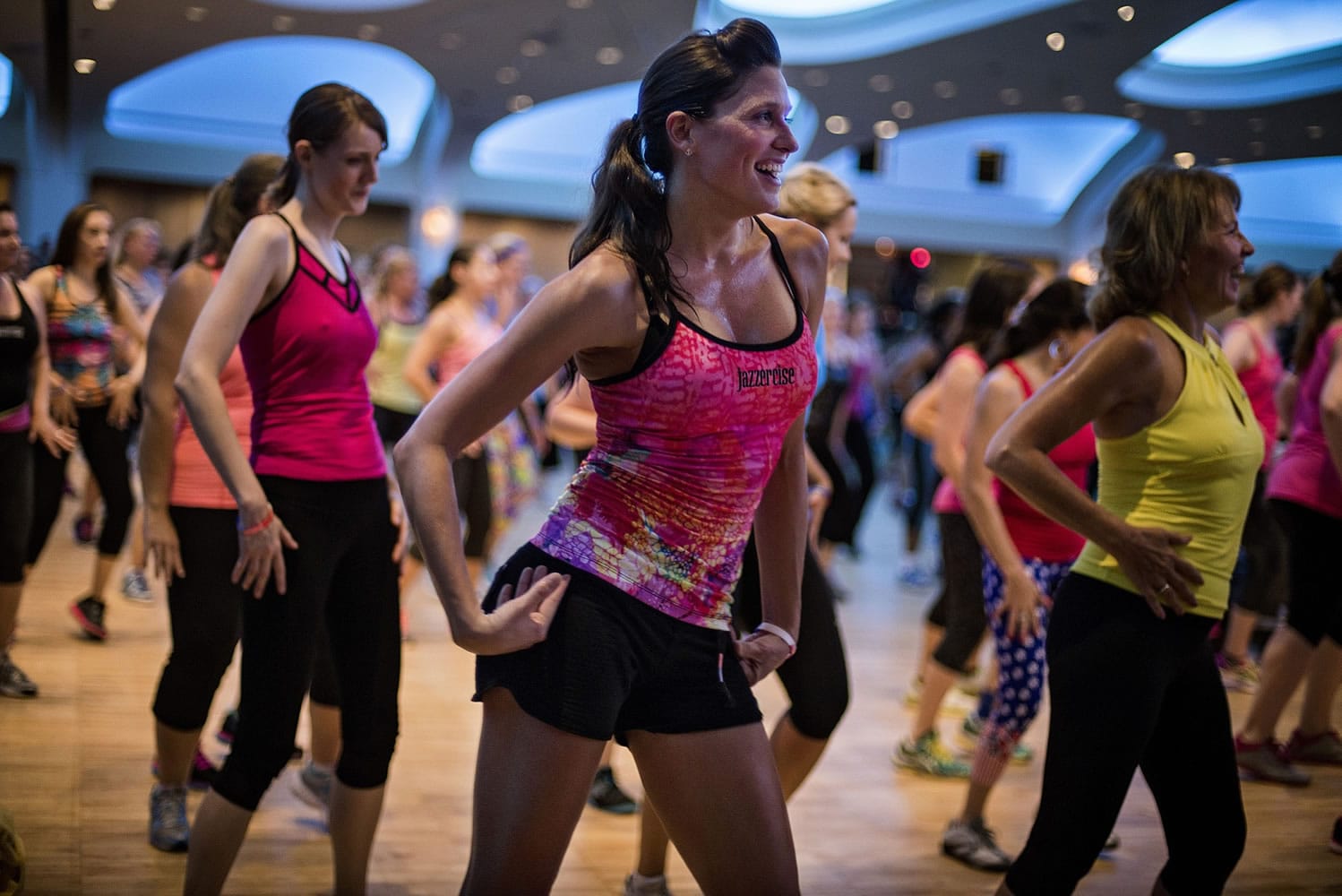 Kristen Smith of Linthicum, Md., dances at a Jazzercise Live event led by Jazzercise founder Judi Sheppard Missett; Jazzercise Live is  an annual event that swoops into a new city each year. Illustrates HEALTH-EXERCISE (category l), by Vicky Hallett, (c) 2014, The Washington Post.  Moved Wednesday, July 09, 2014. (MUST CREDIT: Photo by J.