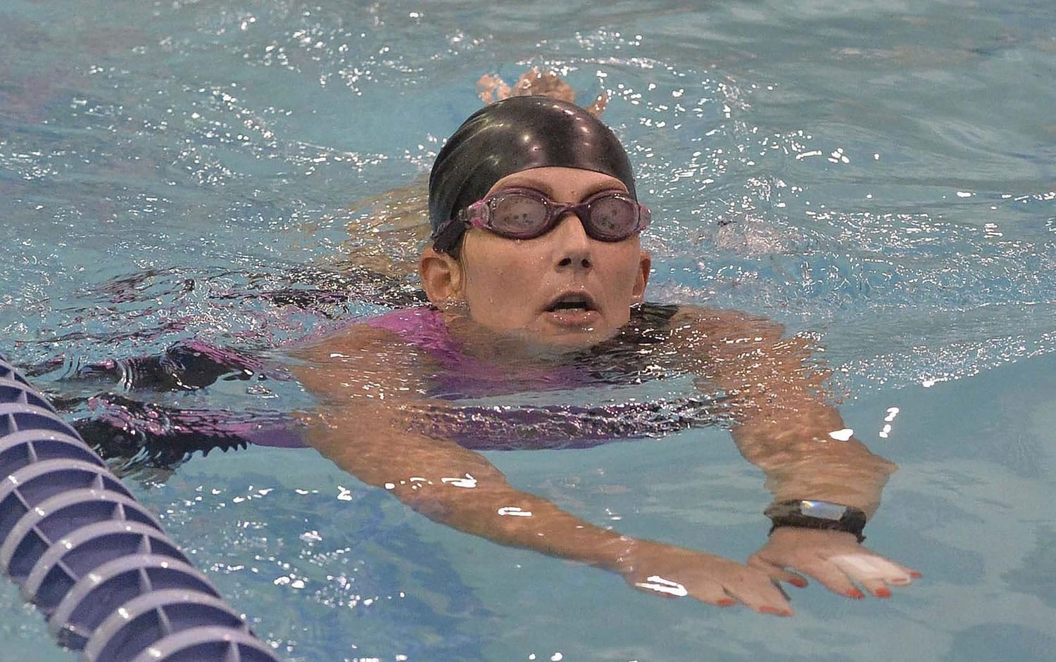 Tonya Hanna swims laps to work on her endurance during a swim lesson.