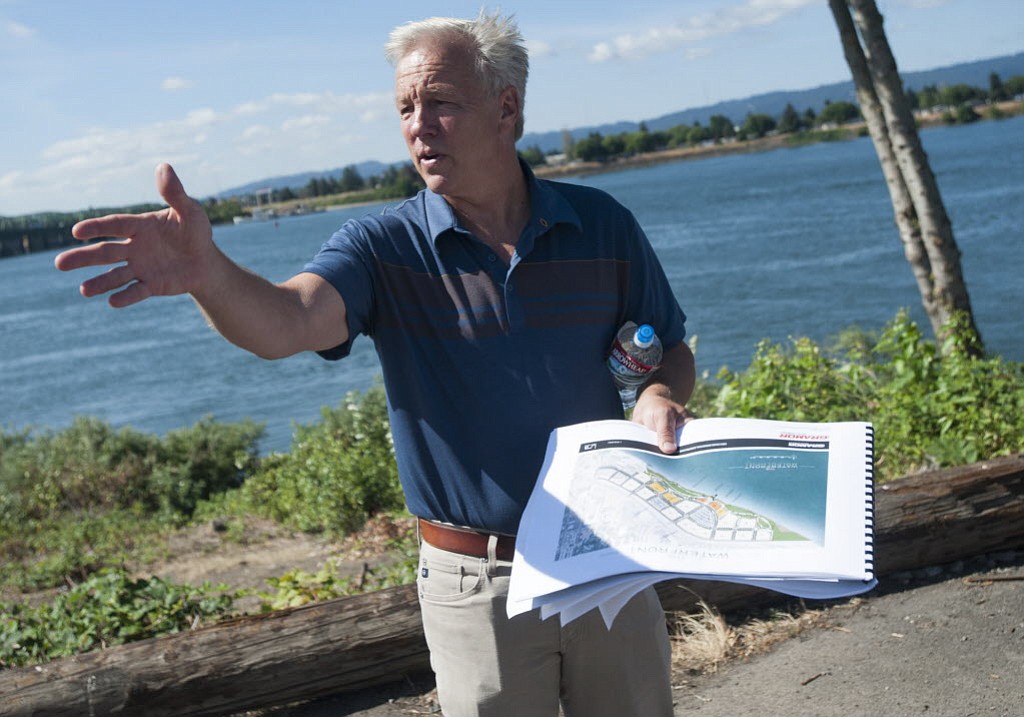 Barry Cain, president of Tualatin-based Gramor Development, leads a group on a tour of the Vancouver waterfront in July.