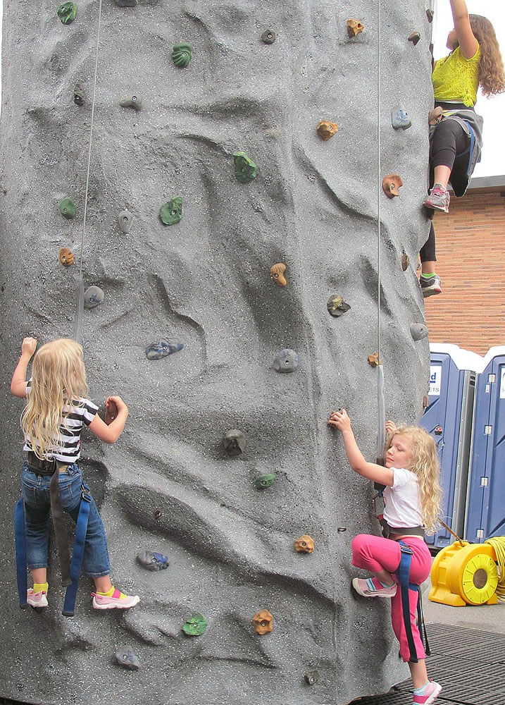 Despite the rainy weather Saturday, the climbing wall still proved to be a popular activity at Kids Street during Camas Days.